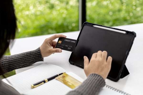 The Benefits of Investing in an Established Business: 10 Top Advantages to Buying an Existing Company 7 woman are typing red credit card information their tablets pay items purchased through online shopping websites online shopping is option that does leave home can shop